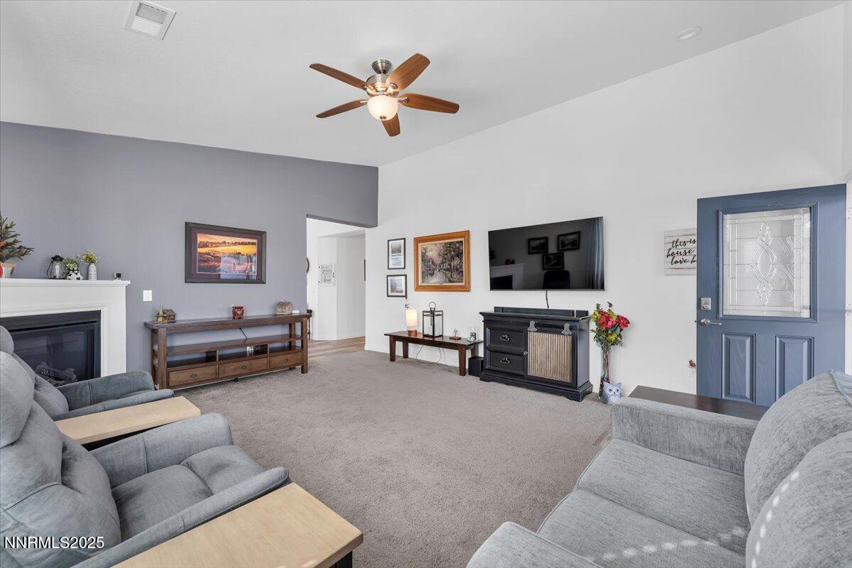 18722 Knott Crk Court Reno, NV 89508 - Photo 8 of 56 a living room with furniture and a flat screen tv