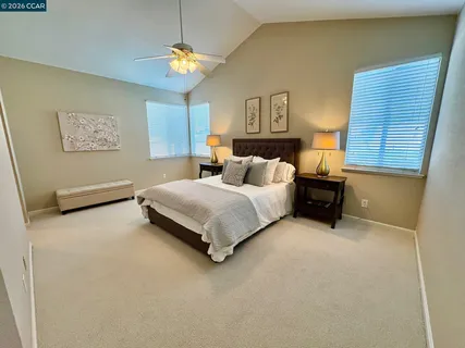 a bedroom with bed and window