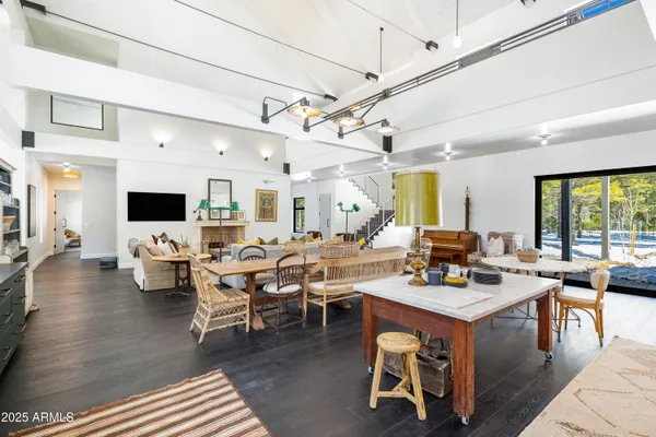 a living room with furniture and flat screen tv