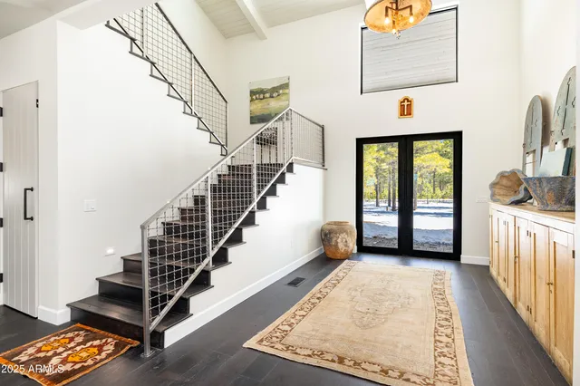 a dining room with furniture window and wooden floor