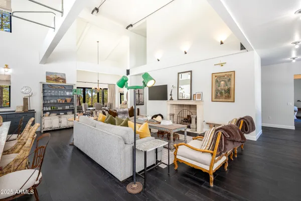 a living room with lots of furniture and a flat screen tv