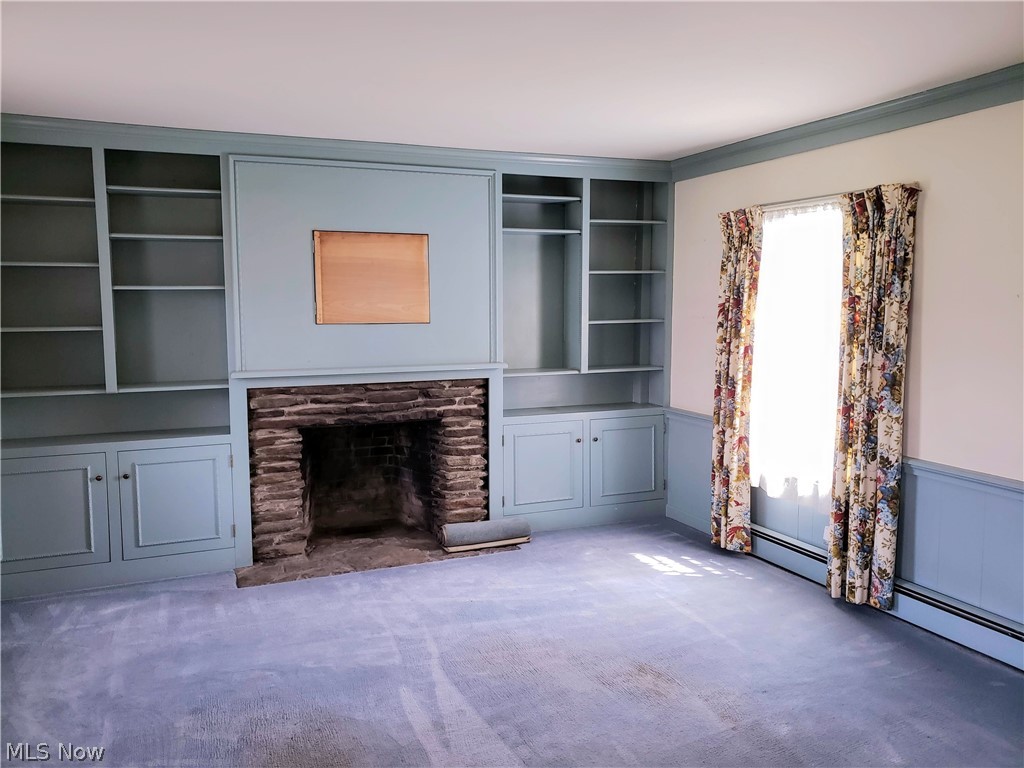 3178 South Ridge Road Perry, OH 44081 - Photo 14 of 29 Parlor with built ins and wood burning fireplace.