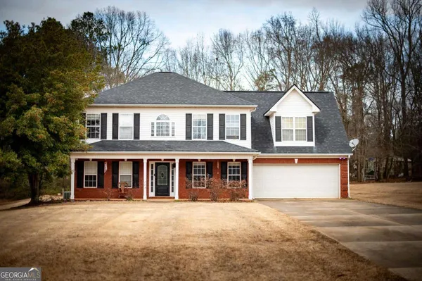 front view of a house with a yard