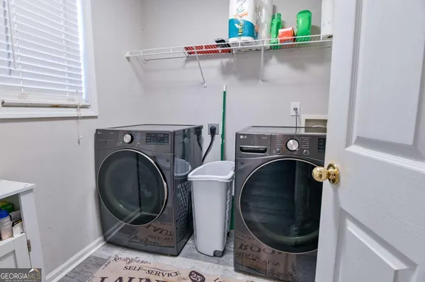 a utility room with dryer and washer