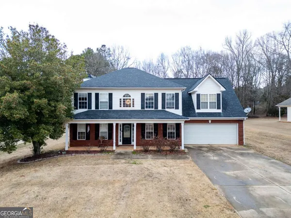 front view of a house with a yard
