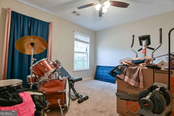 a room with furniture and musical instruments