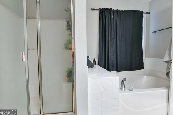 a bathroom with a sink and a bathtub