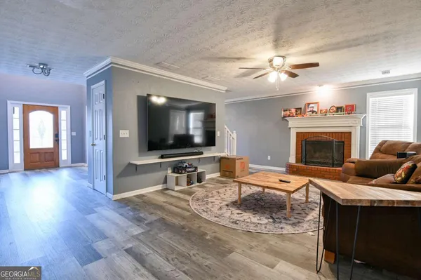 a living room with furniture and a flat screen tv