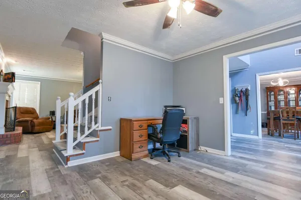 a view of hall way with furniture and entryway