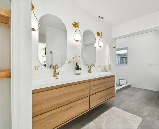 a bathroom with a double vanity sink and a mirror