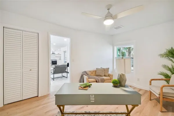 a living room with furniture and a table