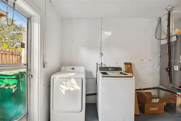 a utility room with dryer and washer