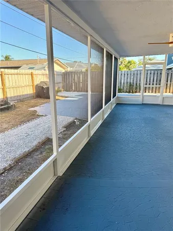 a view of an empty room with a balcony