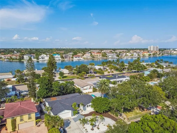 an aerial view of residential building and lake