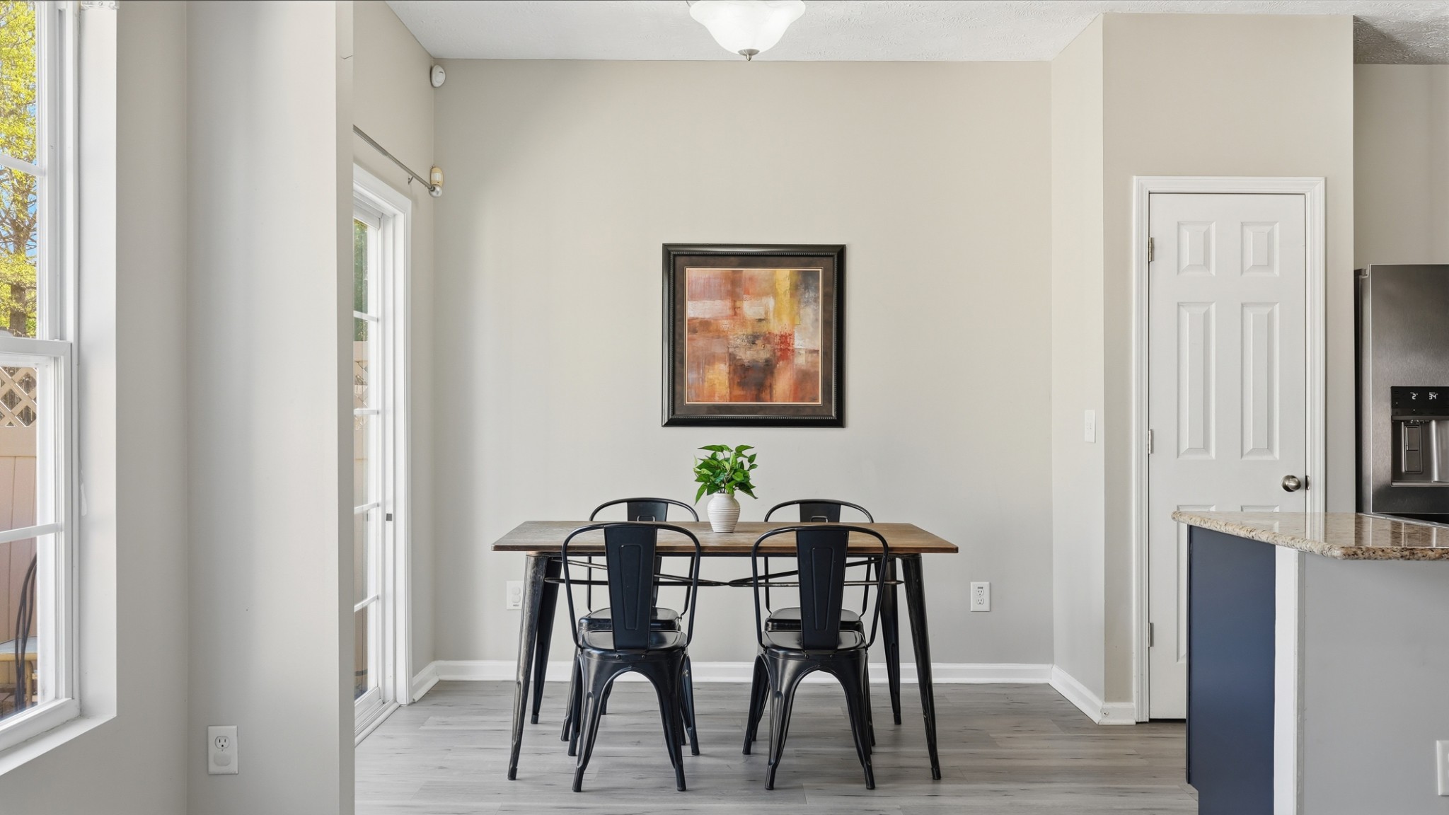 8215 Rossi Road Brentwood, TN 37027 - Photo 11 of 22 a view of a dining room with furniture and wooden floor