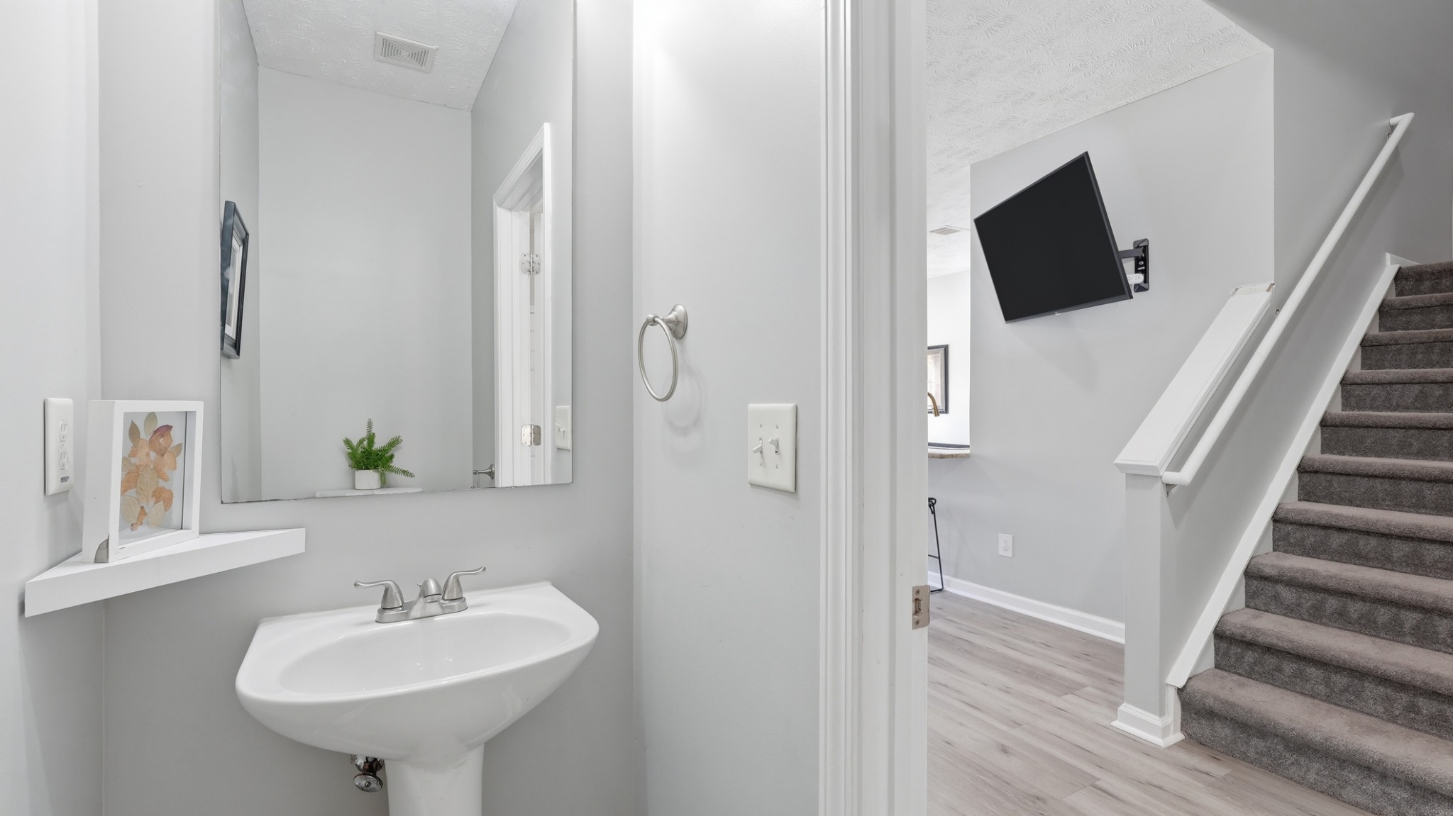 8215 Rossi Road Brentwood, TN 37027 - Photo 13 of 22 a bathroom with a sink and a mirror