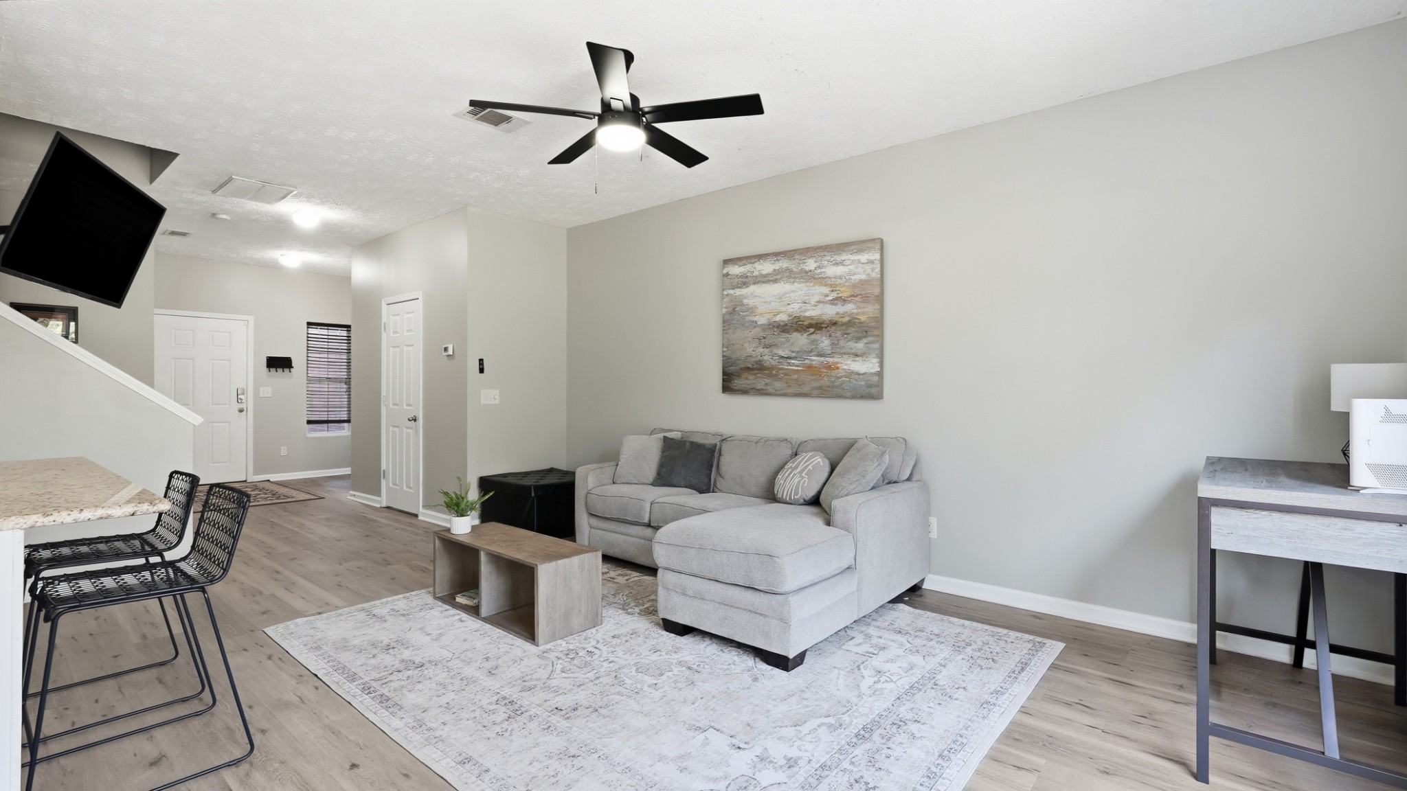 8215 Rossi Road Brentwood, TN 37027 - Photo 5 of 22 a living room with furniture and a flat screen tv