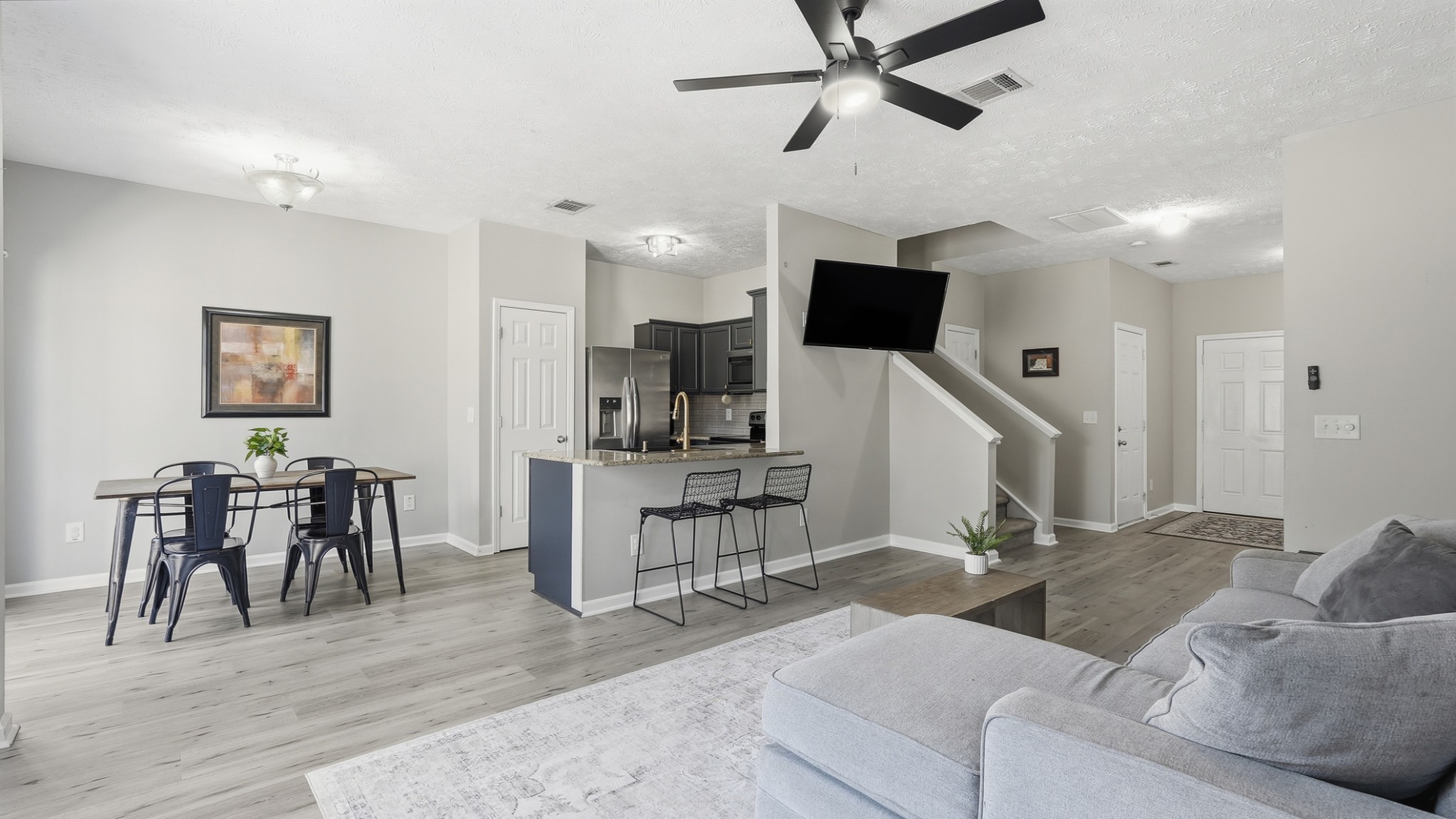 8215 Rossi Road Brentwood, TN 37027 - Photo 6 of 22 a living room with furniture and a flat screen tv