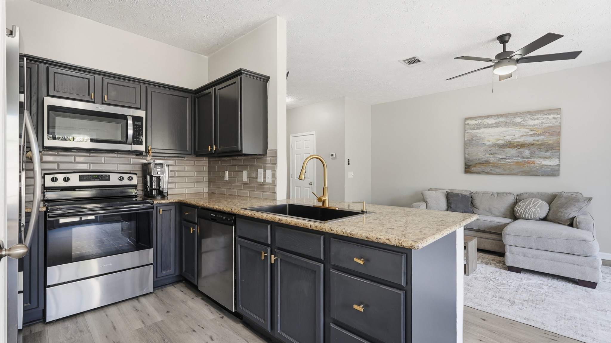 8215 Rossi Road Brentwood, TN 37027 - Photo 10 of 22 a kitchen with a sink appliances and cabinets
