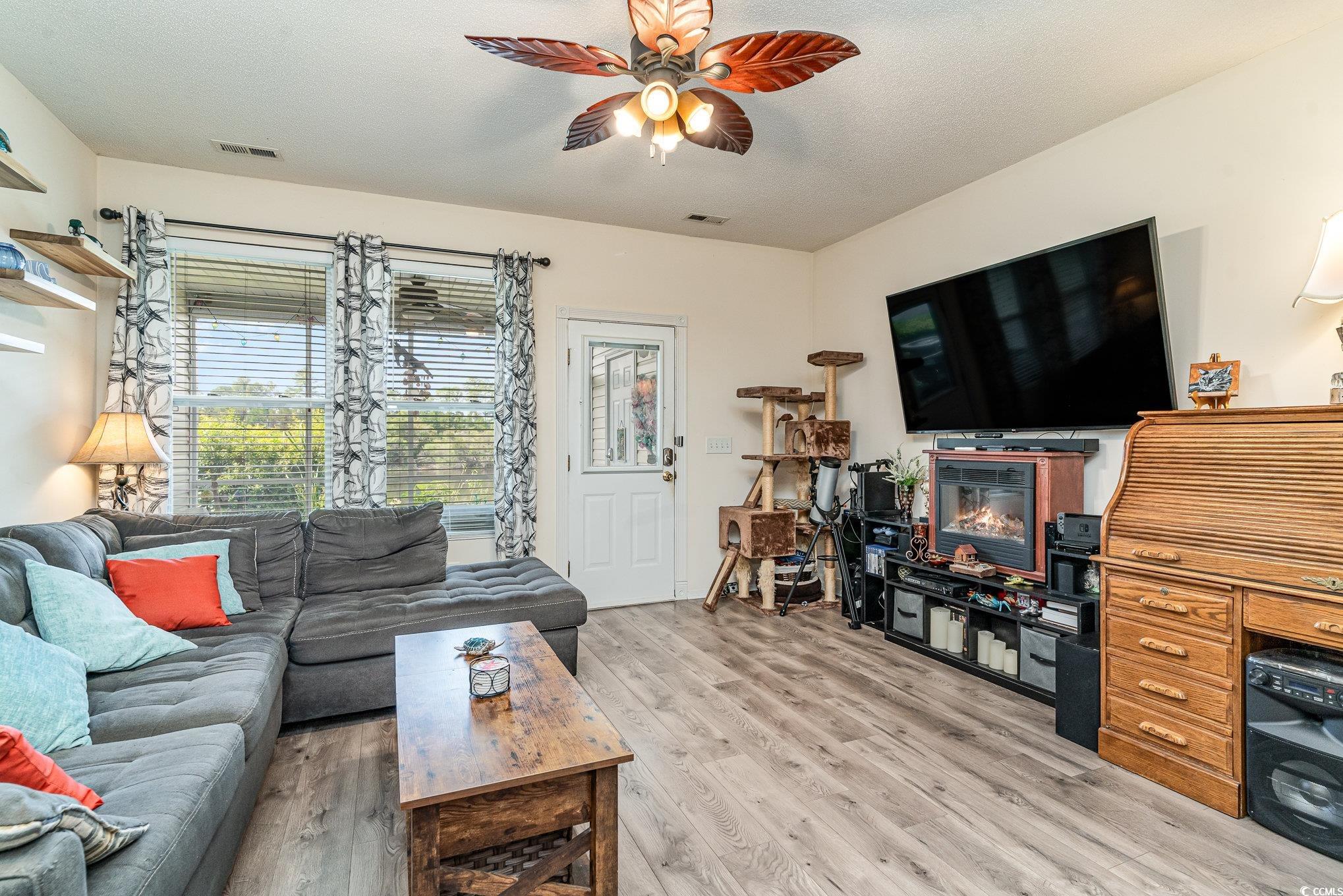 316 Kiskadee Loop, Unit 9E Conway, SC 29526 - Photo 15 of 40 Living room with ceiling fan, light hardwood / woo