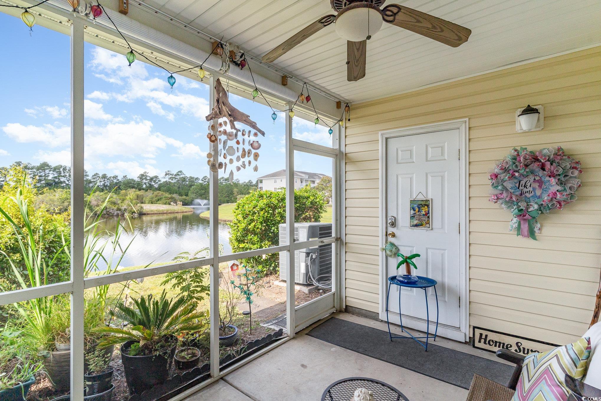 316 Kiskadee Loop, Unit 9E Conway, SC 29526 - Photo 27 of 40 Unfurnished sunroom featuring ceiling fan and a wa