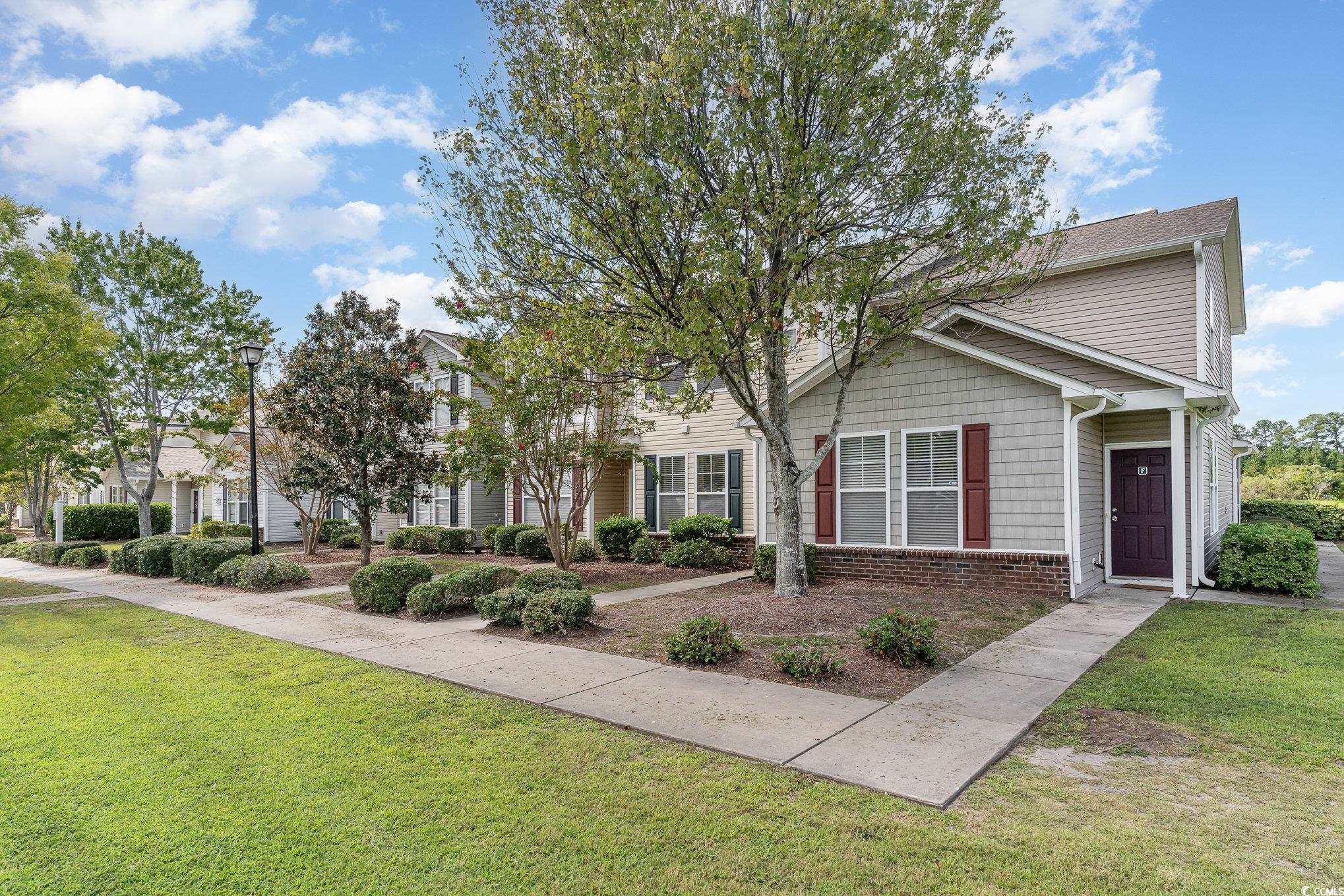 316 Kiskadee Loop, Unit 9E Conway, SC 29526 - Photo 31 of 40 View of front of house featuring a front yard and