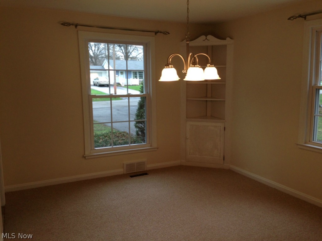 116 Callahan Road Canfield, OH 44406 - Photo 6 of 9 Dining Room with Corner Cupboard for Collectibles with new Chandelier.