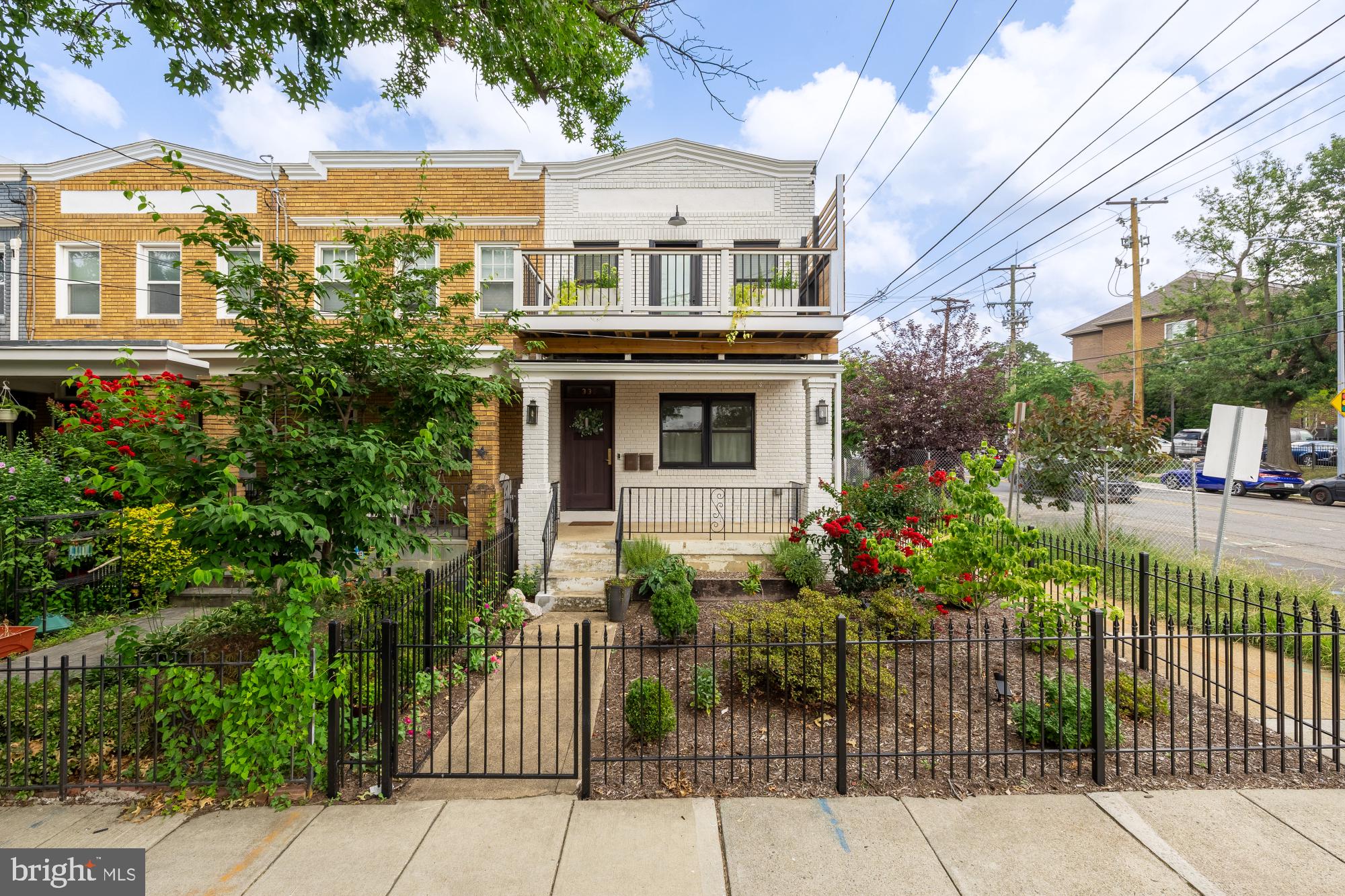 336 Channing Street Northeast, Unit A Washington, DC 20002 - Photo 1 of 28 a front view of a house with a garden