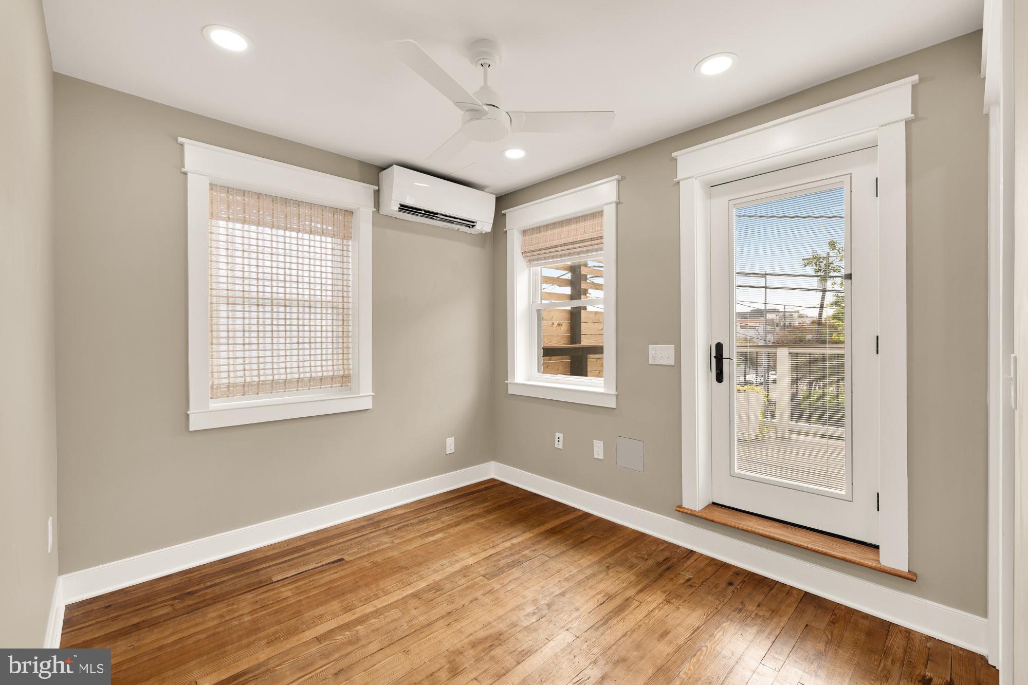 336 Channing Street Northeast, Unit A Washington, DC 20002 - Photo 22 of 28 a view of an empty room with wooden floor and a window