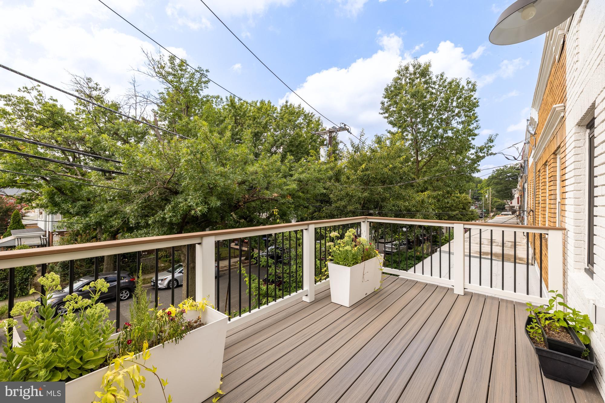 336 Channing Street Northeast, Unit A Washington, DC 20002 - Photo 25 of 28 a balcony with wooden floor and fence