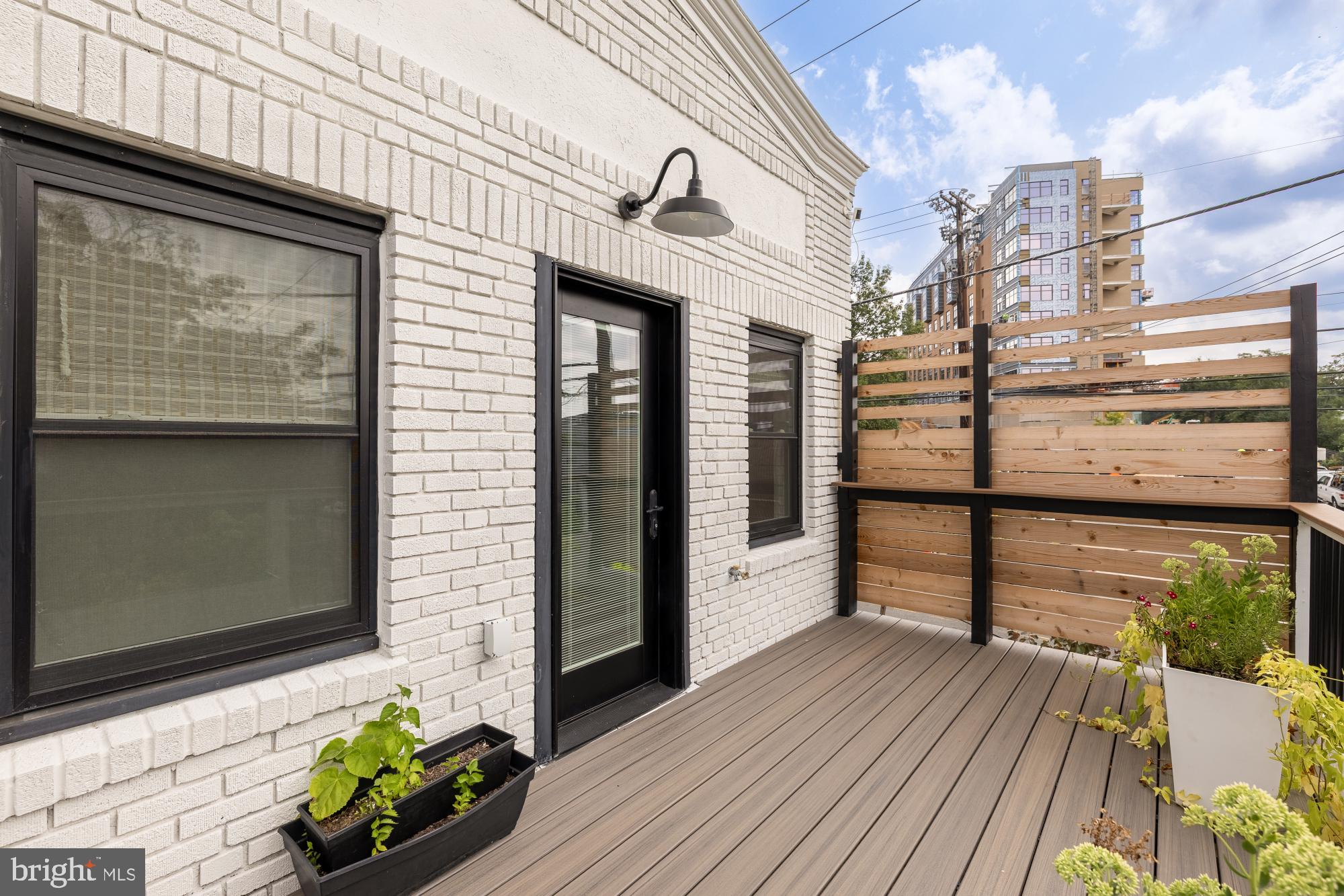 336 Channing Street Northeast, Unit A Washington, DC 20002 - Photo 26 of 28 a front view of a house with a balcony