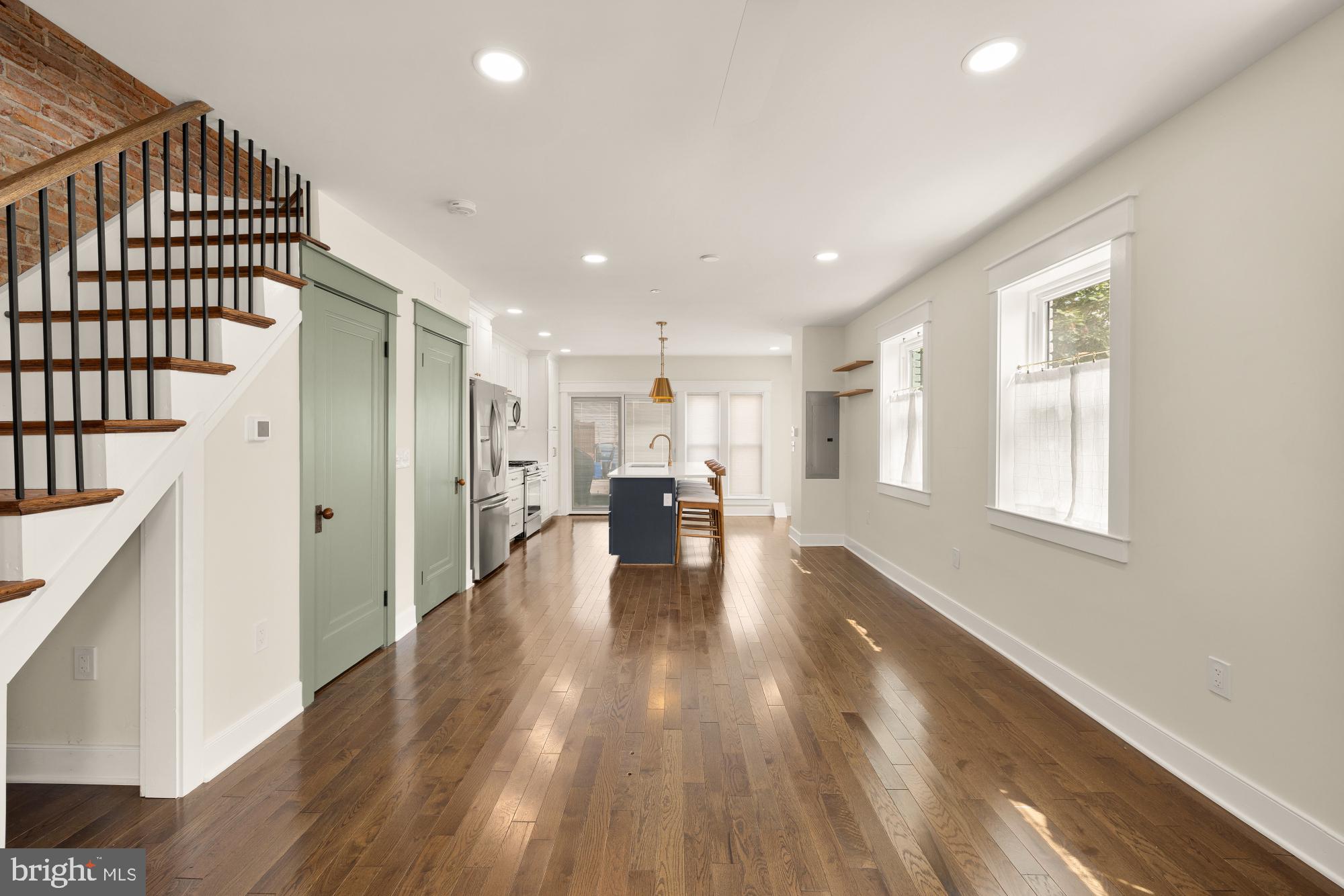 336 Channing Street Northeast, Unit A Washington, DC 20002 - Photo 4 of 28 a view of a living room and dining room with wooden floor