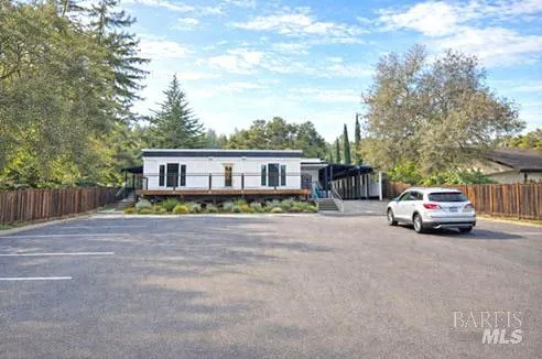 a view of a house with swimming pool and furniture
