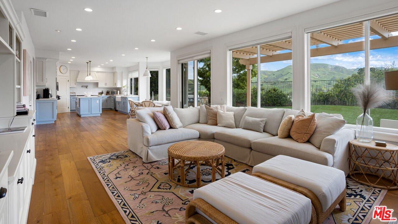 3910 Leighton Point Road Calabasas, CA 91301 - Photo 13 of 29 a living room with furniture and a large window