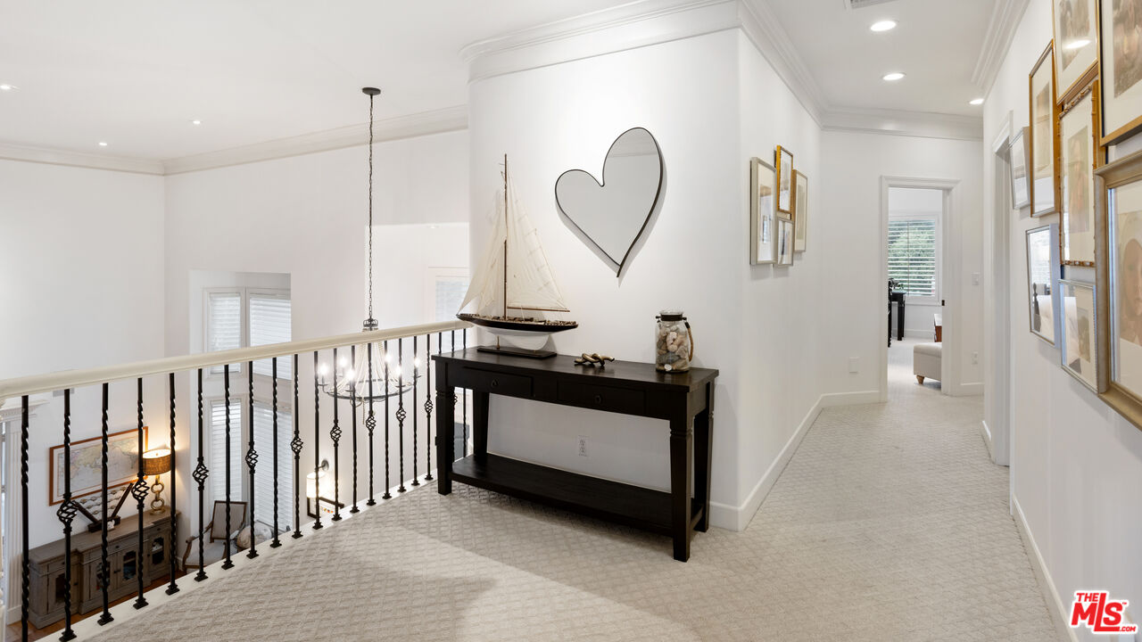 3910 Leighton Point Road Calabasas, CA 91301 - Photo 14 of 29 a kitchen with stainless steel appliances granite countertop a stove a sink and a chandelier