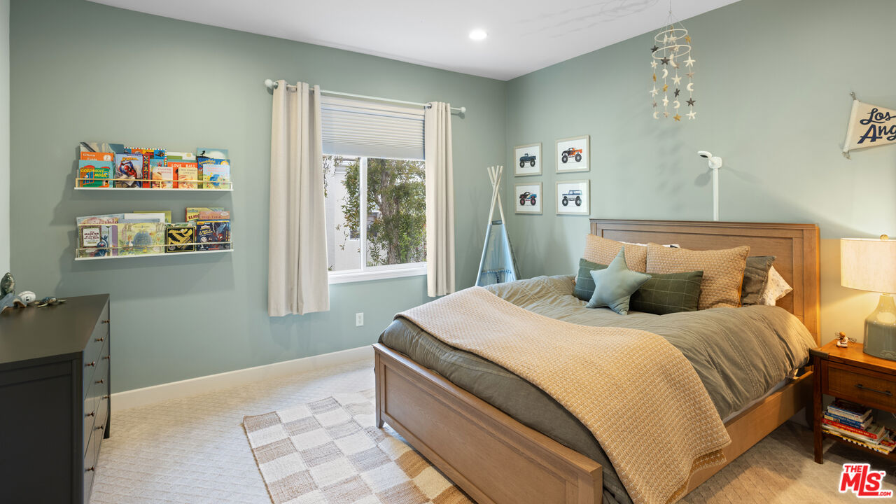 3910 Leighton Point Road Calabasas, CA 91301 - Photo 19 of 29 a bedroom with a bed and a window