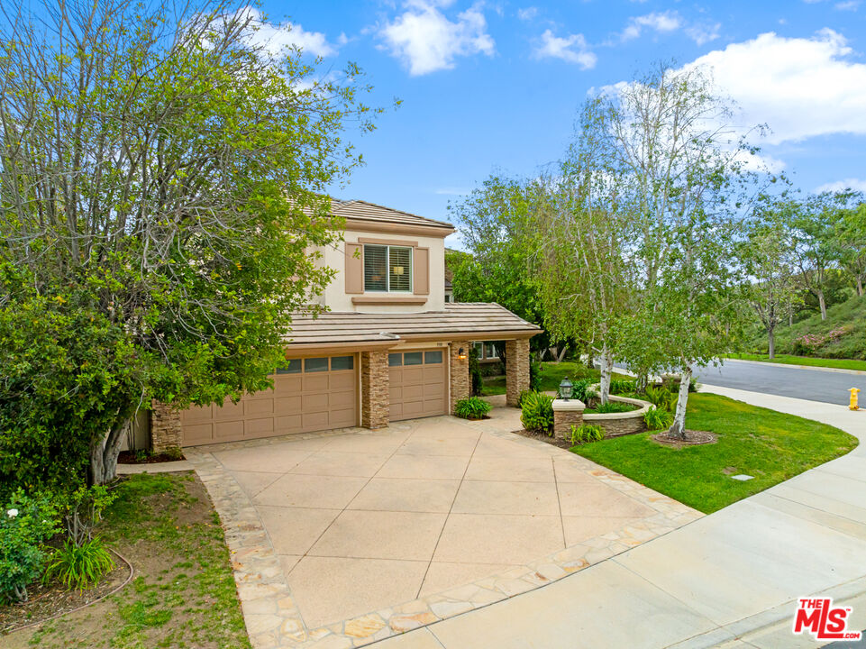 3910 Leighton Point Road Calabasas, CA 91301 - Photo 2 of 29 a front view of a house with garden