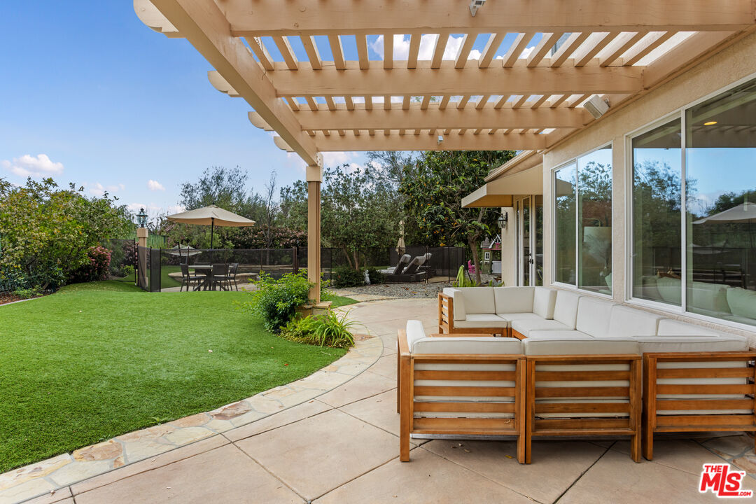 3910 Leighton Point Road Calabasas, CA 91301 - Photo 23 of 29 a outdoor living space with furniture and garden view