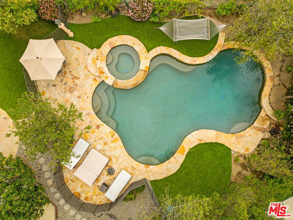 3910 Leighton Point Road Calabasas, CA 91301 - Photo 27 of 29 an aerial view of a swimming pool and outdoor space