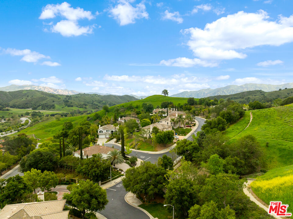 3910 Leighton Point Road Calabasas, CA 91301 - Photo 29 of 29 a view of a city with mountains in the background