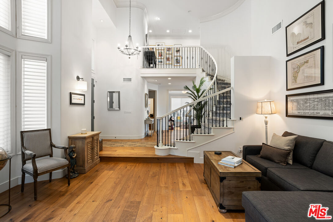 3910 Leighton Point Road Calabasas, CA 91301 - Photo 6 of 29 a living room with furniture and a wooden floor