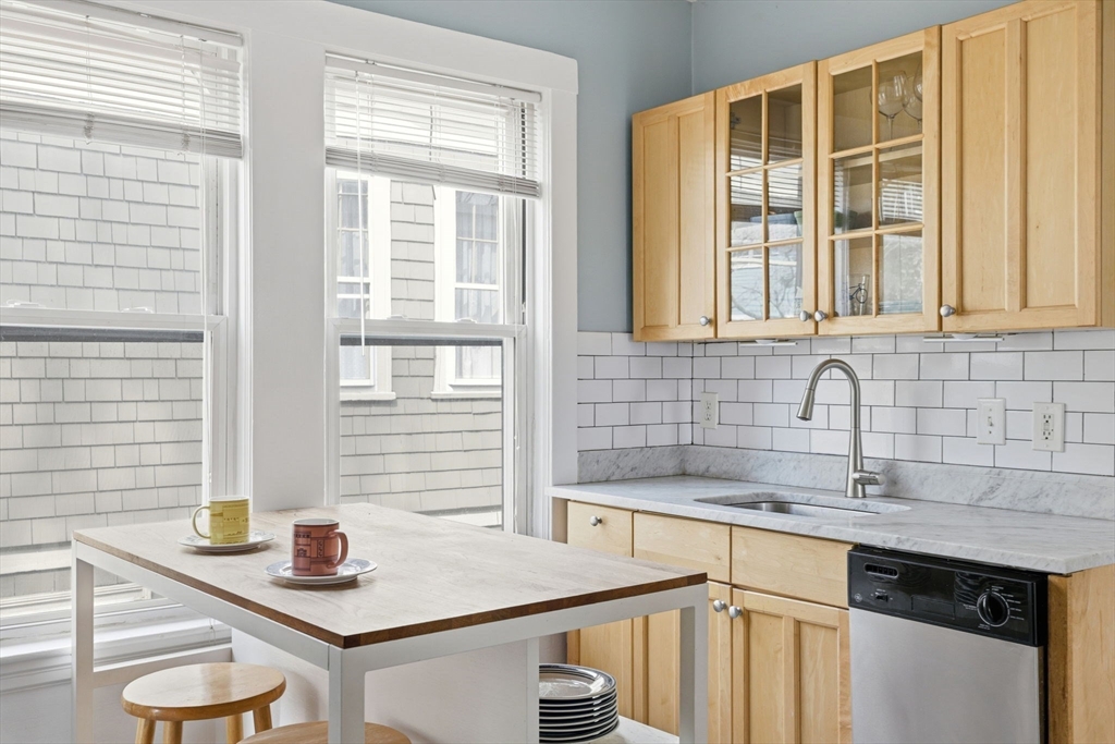 85 Jamaica Street, Unit 3 Boston, MA 02130 - Photo 1 of 19 a kitchen with a sink and a window