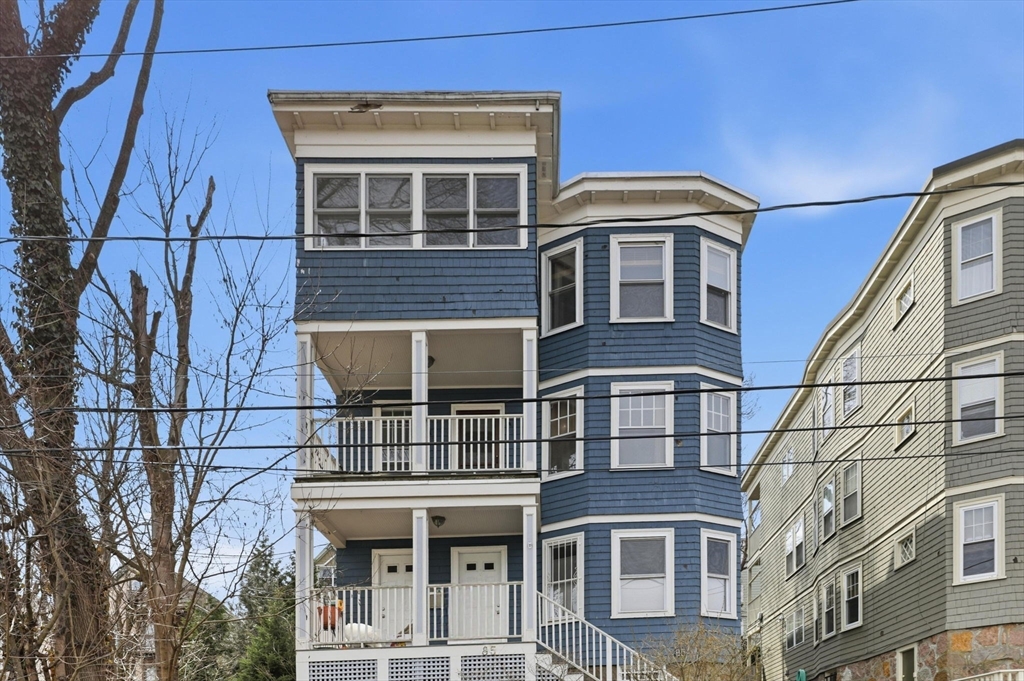 85 Jamaica Street, Unit 3 Boston, MA 02130 - Photo 13 of 19 a front view of a building with glass windows