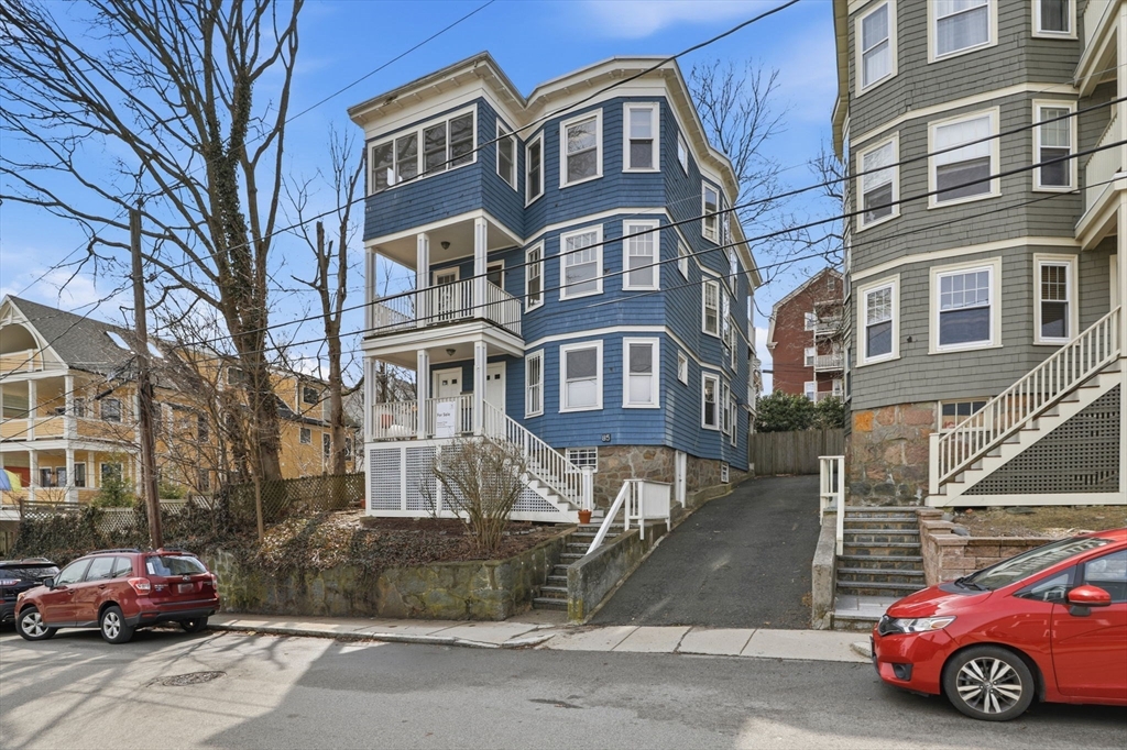 85 Jamaica Street, Unit 3 Boston, MA 02130 - Photo 14 of 19 a car parked in front of a building
