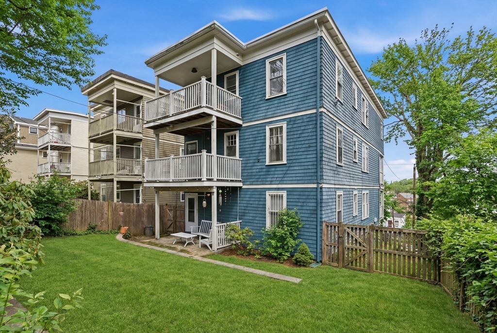 85 Jamaica Street, Unit 3 Boston, MA 02130 - Photo 16 of 19 a front view of a house with a yard