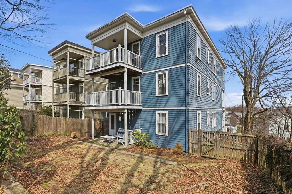 85 Jamaica Street, Unit 3 Boston, MA 02130 - Photo 17 of 19 a front view of a house with a yard