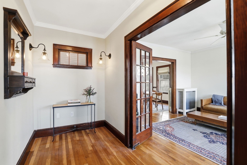 85 Jamaica Street, Unit 3 Boston, MA 02130 - Photo 5 of 19 a bedroom with furniture and a window