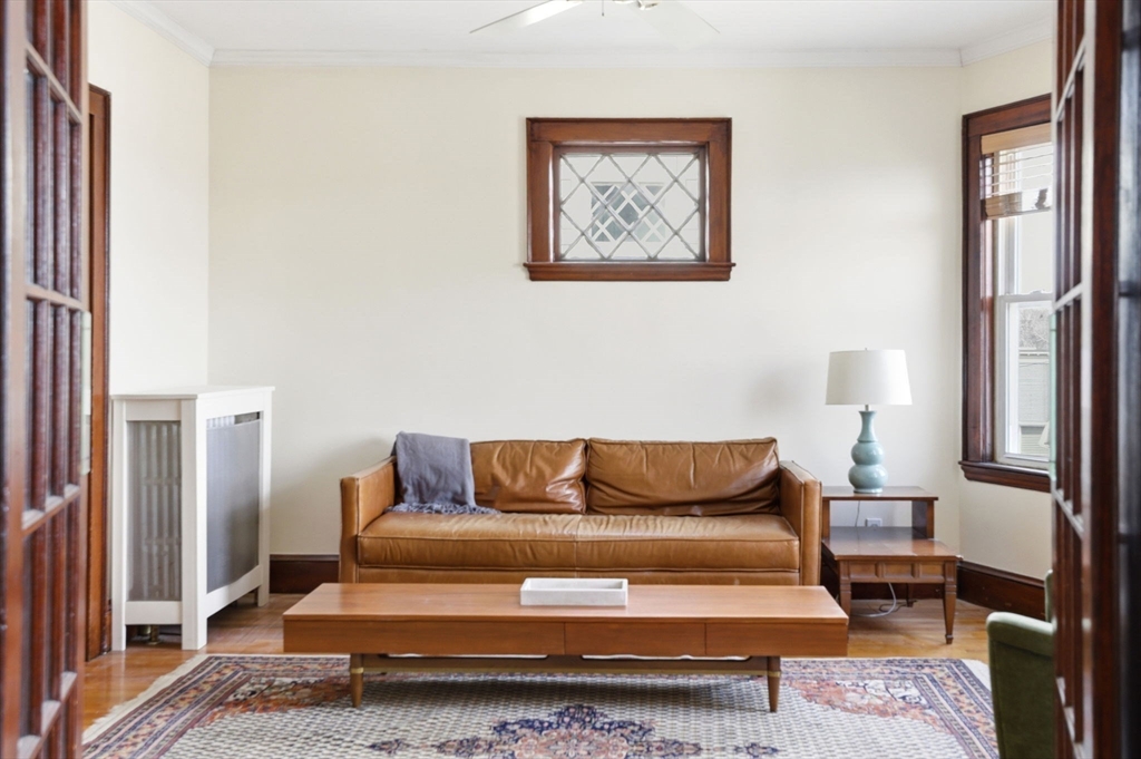 85 Jamaica Street, Unit 3 Boston, MA 02130 - Photo 7 of 19 a living room with furniture and a lamp