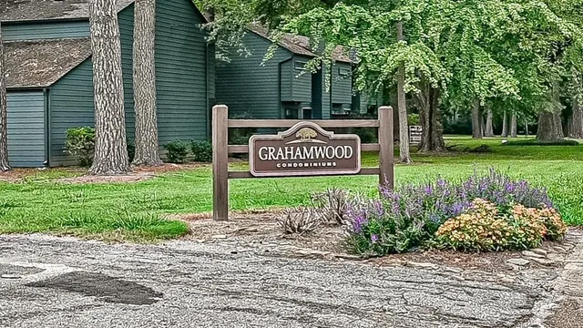 a sign that is sitting in front of a house