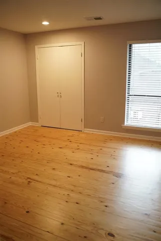 a bathroom with a toilet and a bath tub